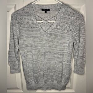 Women’s v-neck with criss cross design, 3/4 sleeve, xs.